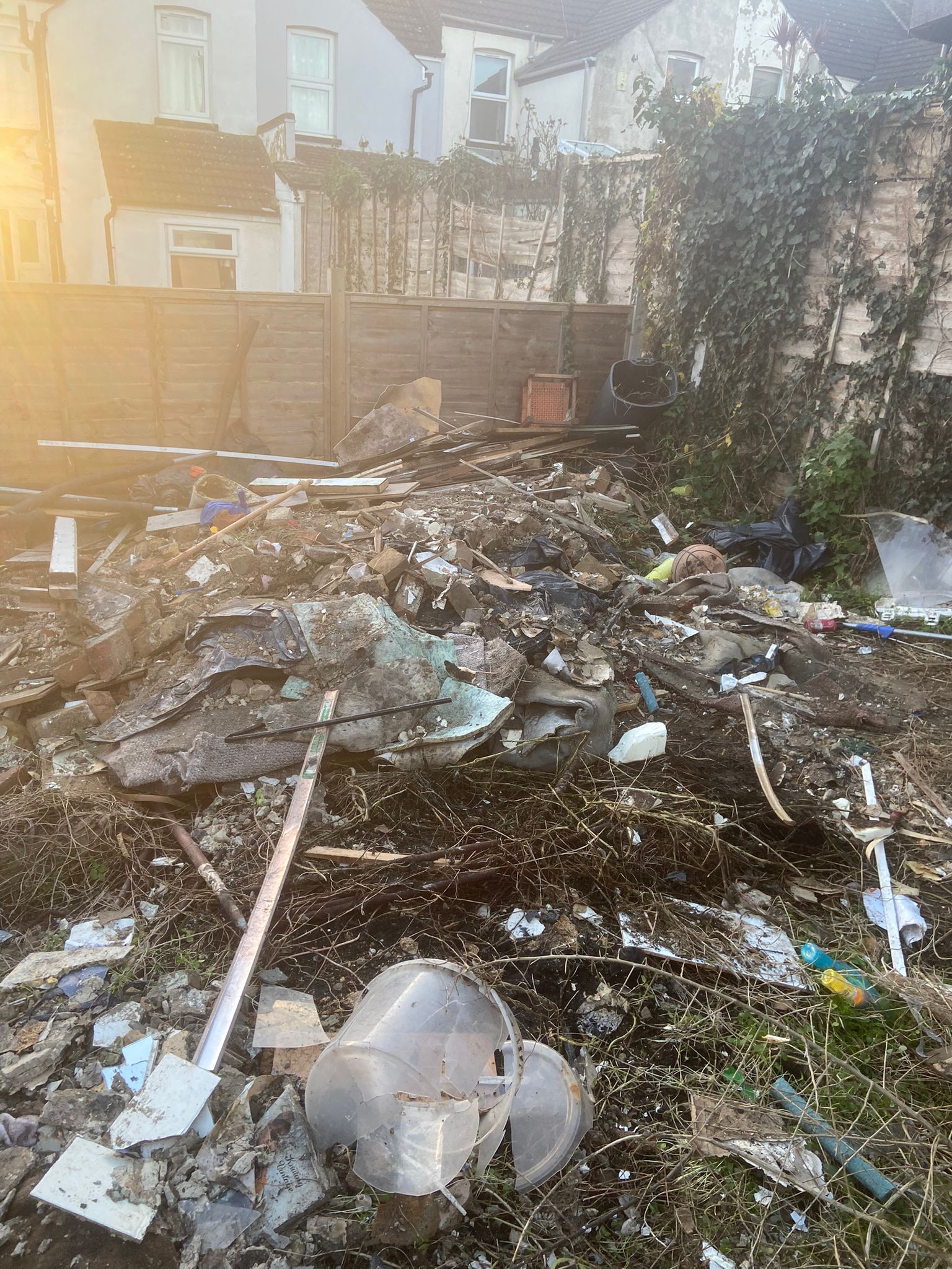 Pile of builders waste and rubble in a Medway yard before being cleared by our waste removal team