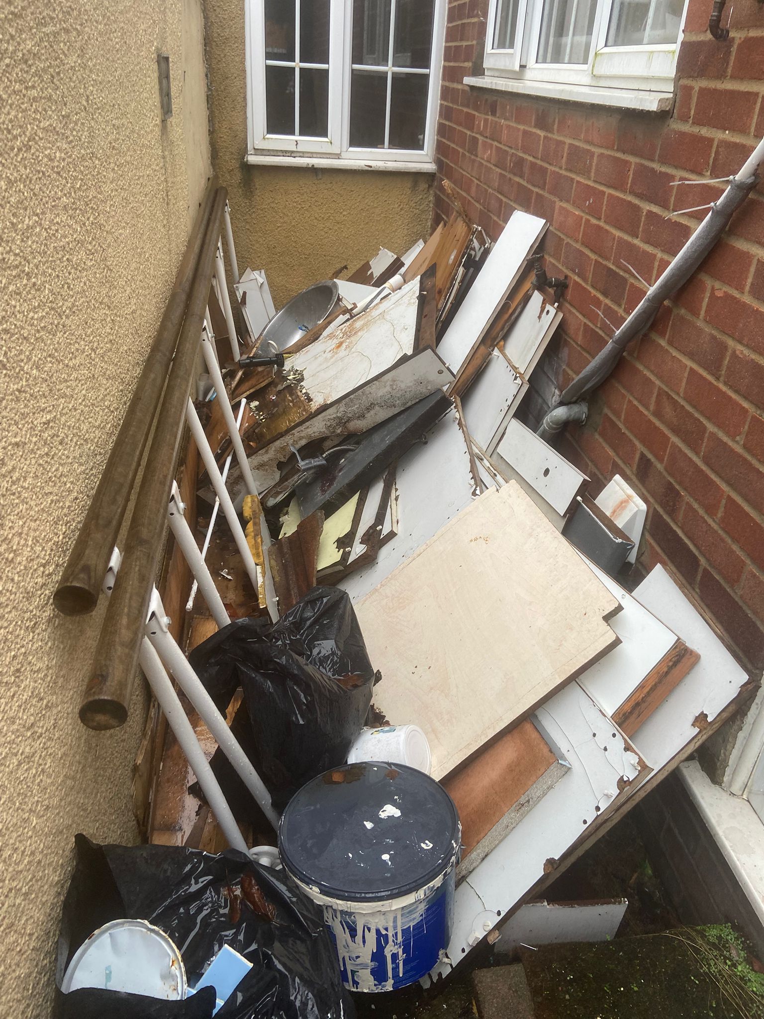 Side alley in Medway full of household waste and debris before Medway Rubbish Removal clearance